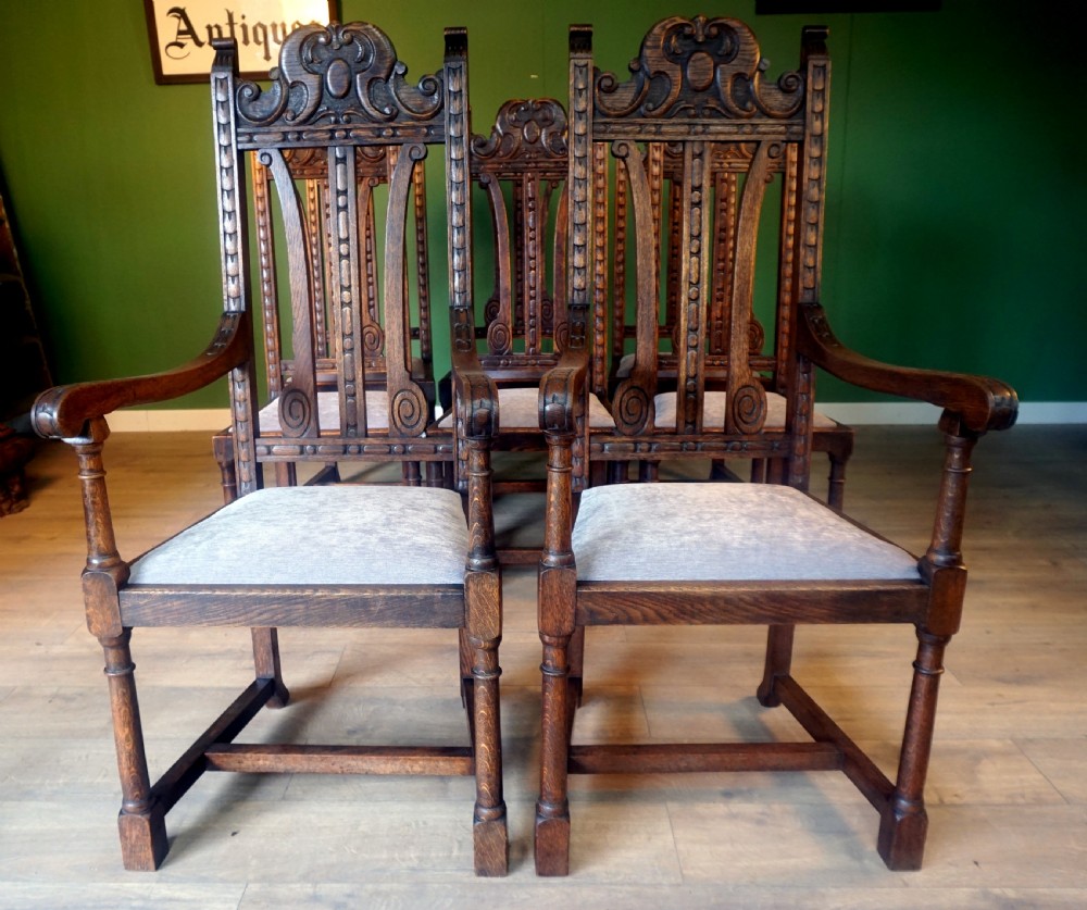 A good substantial set of 8 solid oak carved chairs View II