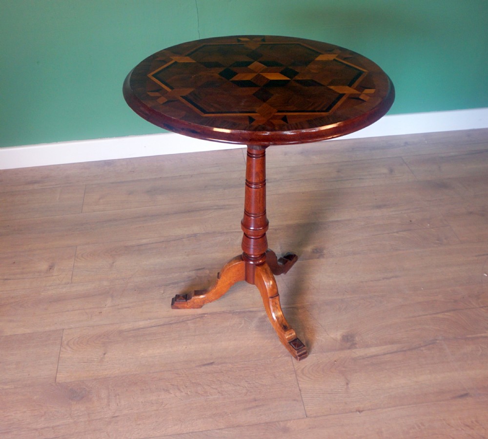 An absolutely stunning tripod tilt top specimen wood inlaid table