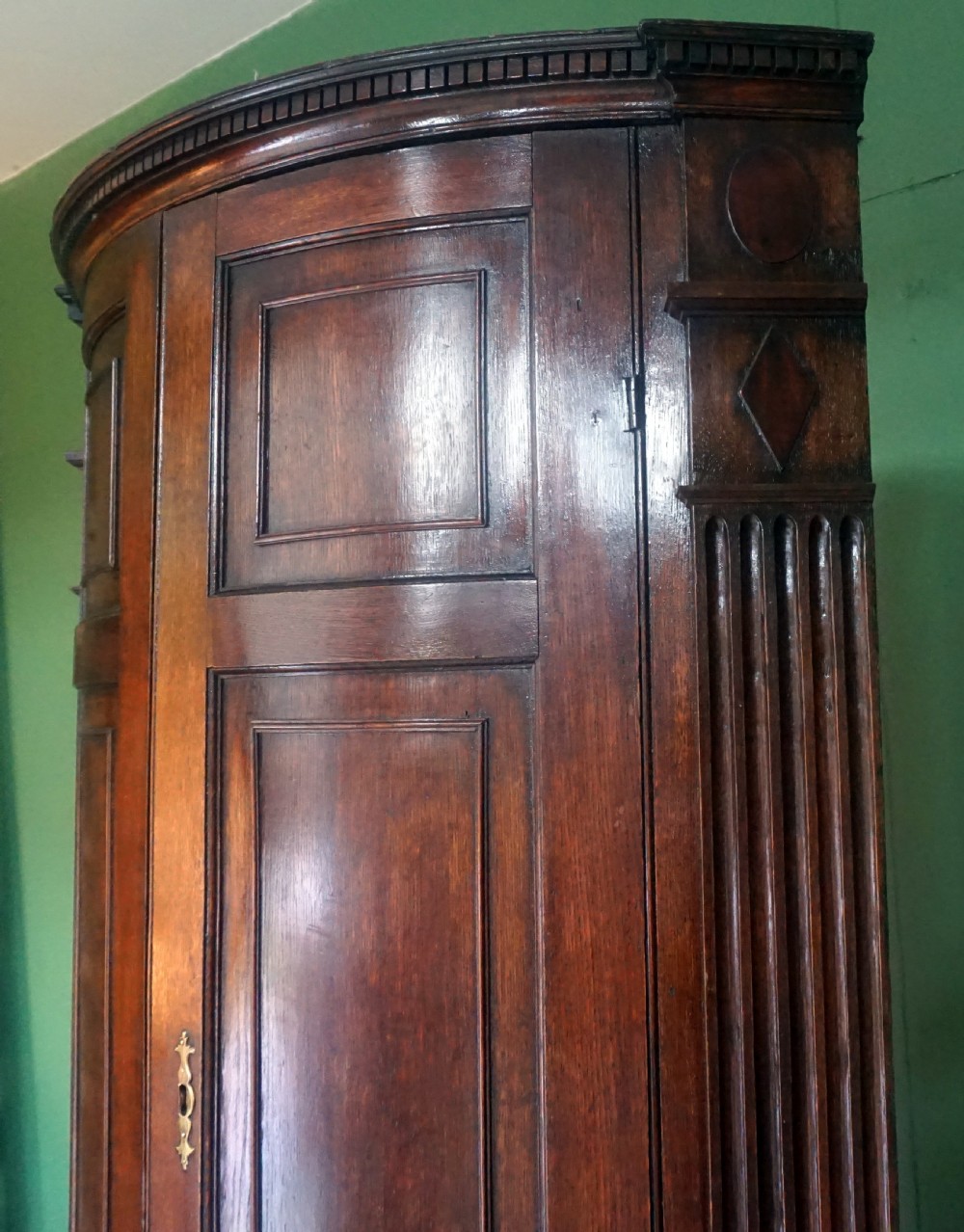 A great original example of a bow fronted Oak Georgina floor standing corner cupboard View IV