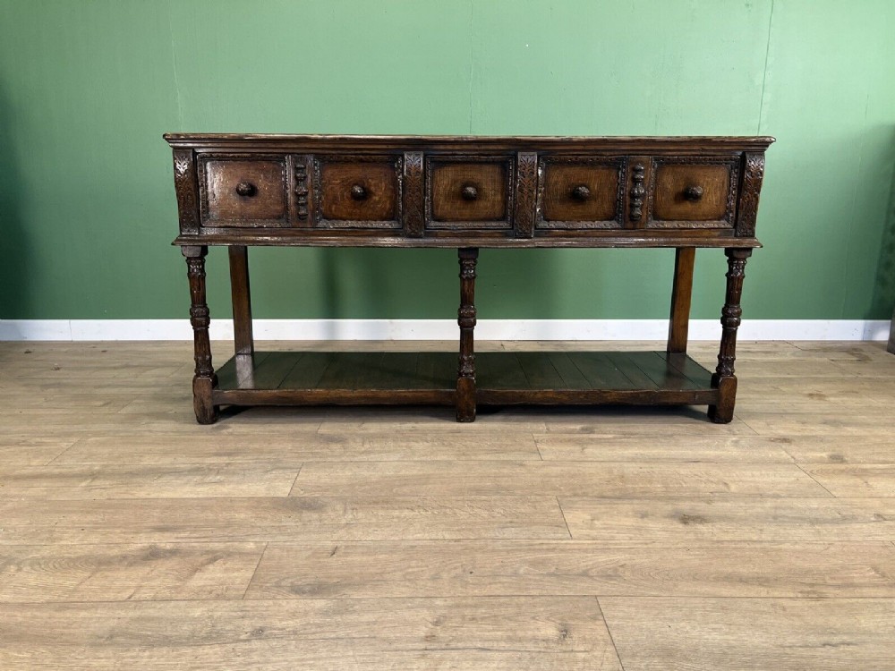Elizabethan style oak pot board dresser.