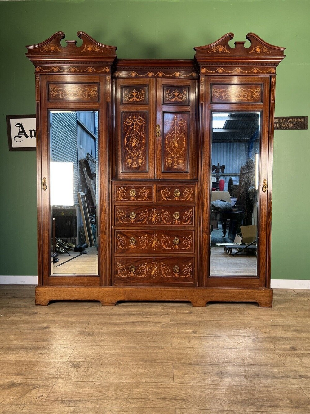 A stunning inlaid antique combination wardrobe