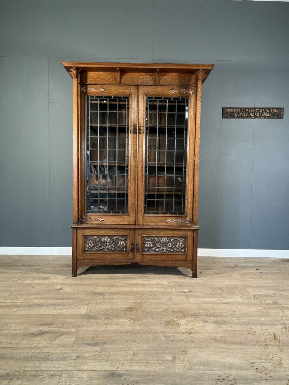 Arts and crafts oak leaded bookcase.