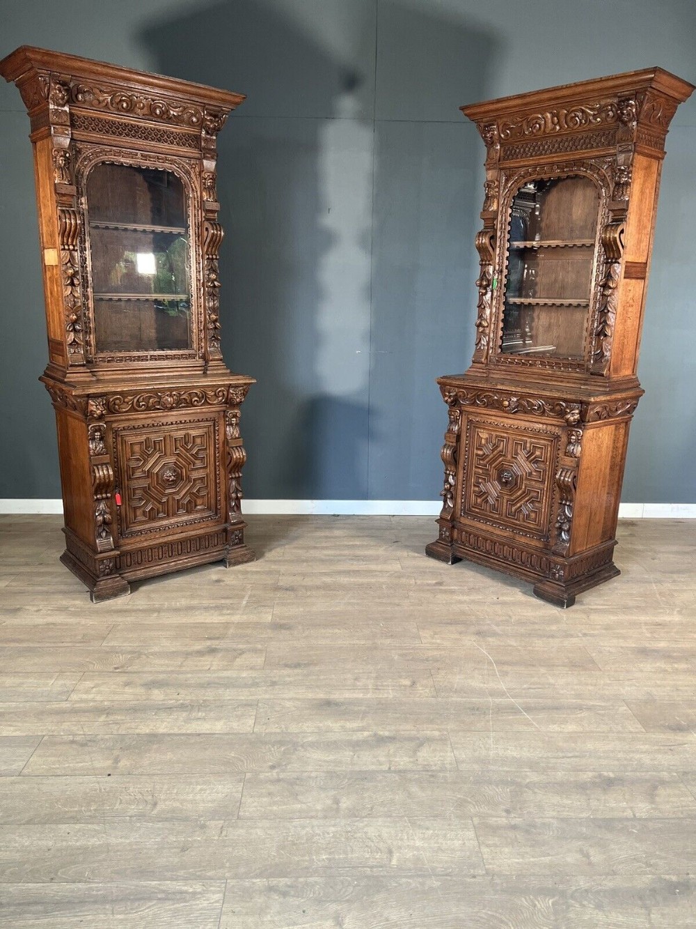 A good pair of carved oak cupboard bookcases