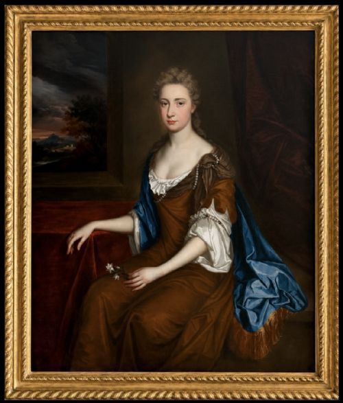 fig 1. A seventeenth-century Baroque oil portrait of a lady in a brown dress and blue drapery, set within a carved giltwood frame.