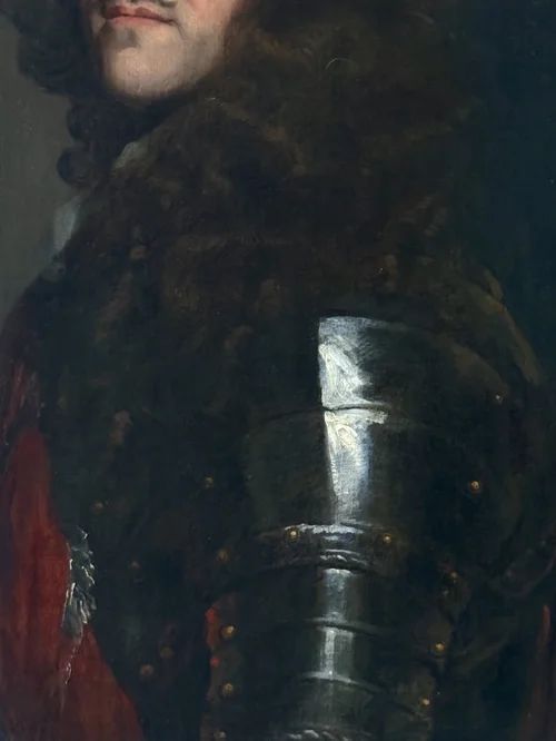 fig 5. A half-length portrait painting of a 17th-century man with dark curling hair, wearing steel plate armour and a red sash against a dark background.