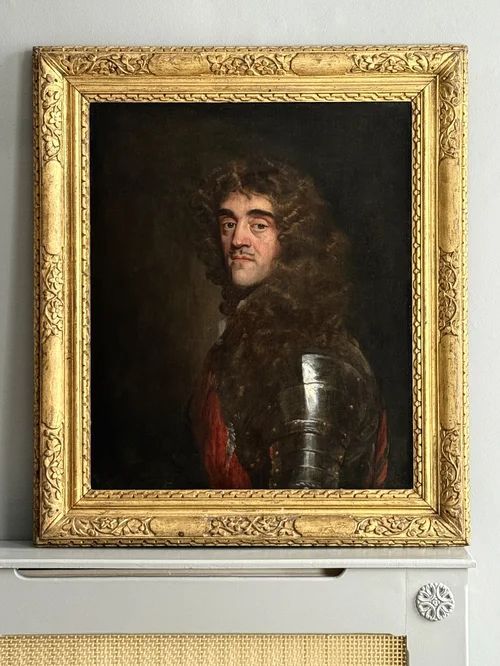 fig 6. A half-length portrait painting of a 17th-century man with dark curling hair, wearing steel plate armour and a red sash against a dark background.