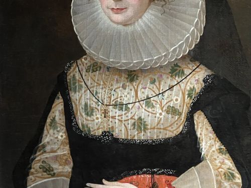 fig 2. A 17th-century oil painting depicting a noblewoman wearing a large white cartwheel ruff collar, embroidered floral bodice, black gown, and red coral bead bracelets.