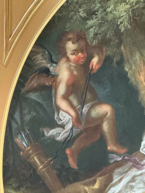 fig 2. A pair of square gilded frames housing circular 18th-century classical oil paintings depicting mythological figures in landscape settings.