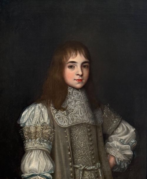 fig 2. A seventeenth-century oil portrait depicting a young gentleman wearing an intricate lace collar and embroidered clothing in a carved silvered frame.
