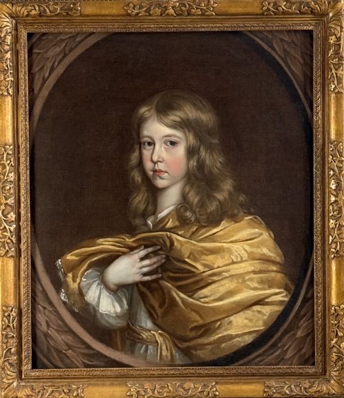 fig 4. A 17th-century oil portrait of a young boy with long curled hair draped in golden-yellow silk, set within a painted trompe loeil oval border.