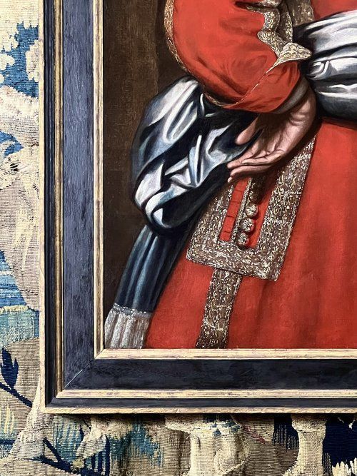 fig 5. A 17th-century oil portrait depicting a male military officer in an embellished red tunic with a wide collar and silver waist sash.