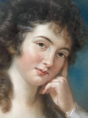fig 1. An 18th-century oval pastel portrait of a woman with curly hair wearing a white lace dress in a gold gilt frame.