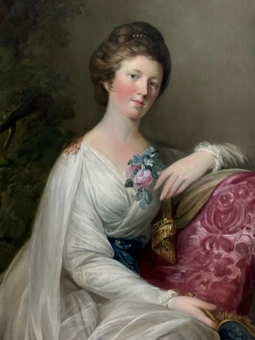 fig 5. An 18th-century oil painting depicting a seated woman in a draped white gown holding a floral corsage and an oval object beside a pink cushion.