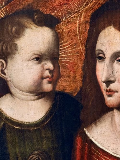 fig 5. An oil on canvas painting featuring the Virgin Mary holding a small book alongside the Christ Child, enclosed in a dark ebonised frame with a gilt inner border.
