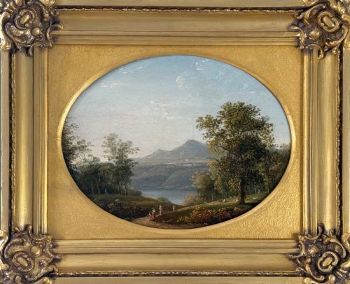fig 1. An 18th-century classical landscape oil painting set within an oval spandrel inside an ornate giltwood frame.
