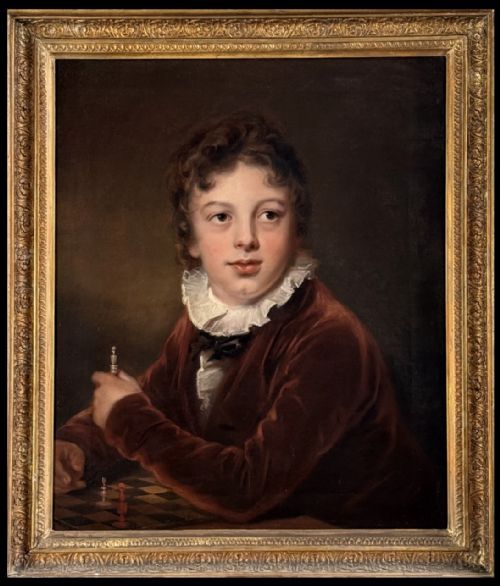 fig 2. An antique oil painting depicting a young boy in a brown velvet coat with a white ruffled collar holding a chess piece.