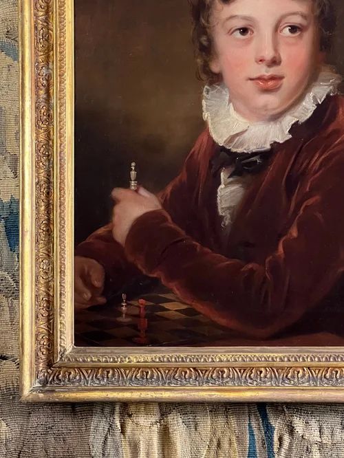 fig 5. An antique oil painting depicting a young boy in a brown velvet coat with a white ruffled collar holding a chess piece.