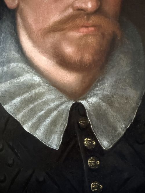 fig 1. An early 17th-century oil portrait on canvas depicting a bearded gentleman wearing a white pleated ruff and a dark patterned doublet.