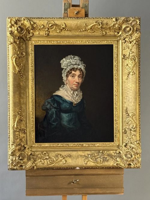 fig 4. A set of three 19th-century Regency oil portraits painted on wood panels, housed in elaborate, heavily carved giltwood frames.