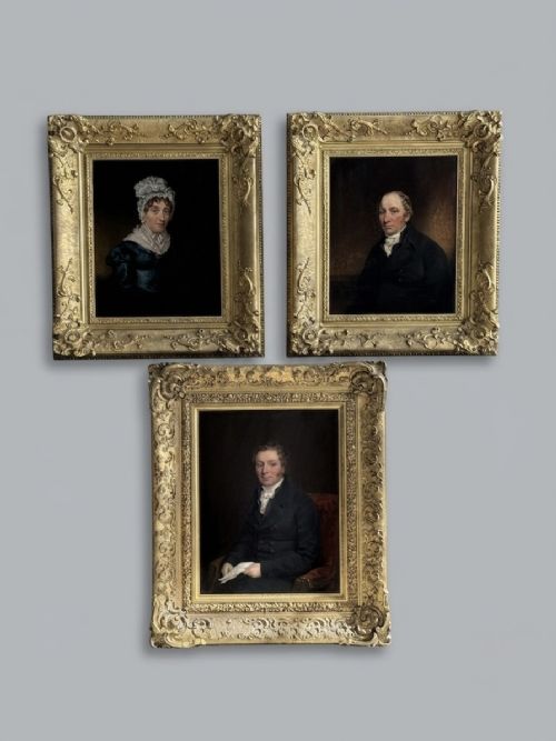 fig 1. A set of three 19th-century Regency oil portraits painted on wood panels, housed in elaborate, heavily carved giltwood frames.