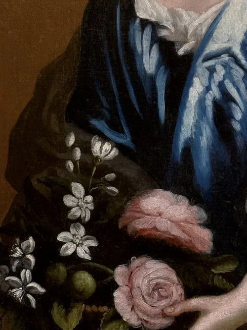 fig 5. An 18th-century oil painting depicting a lady in a draped blue dress holding a flower basket, set in an ornate gilt frame.