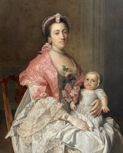 fig 1. An 18th-century oil painting on canvas depicting a seated lady in a lace dress and pink shawl holding a child.