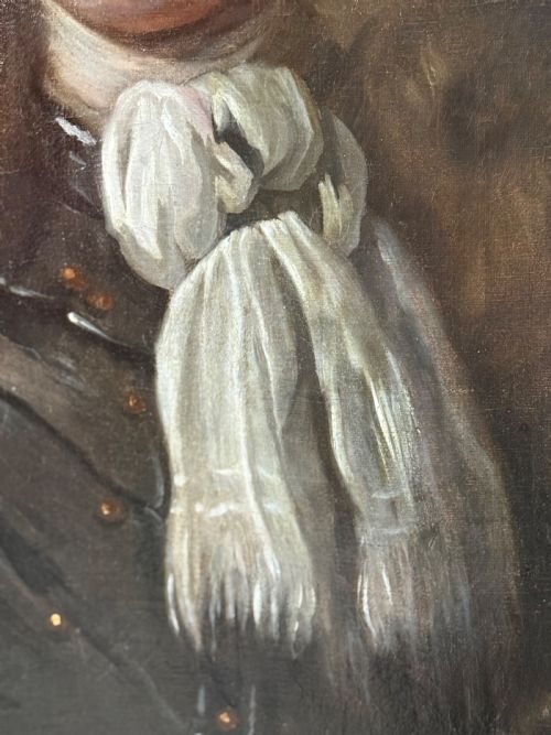 fig 3. An oval late 17th-century oil portrait of a long-haired nobleman in dark plate armour with a white cravat, set within a carved gilt frame.