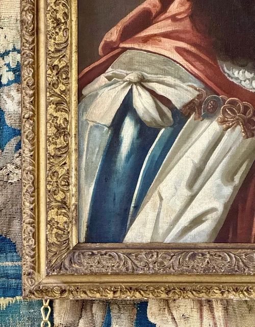 fig 1. A seventeenth-century oil portrait of King Charles II depicting a long periwig, detailed lace cravat, and a draped red mantle.