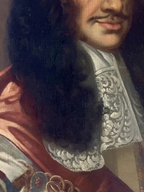 fig 2. A seventeenth-century oil portrait of King Charles II depicting a long periwig, detailed lace cravat, and a draped red mantle.