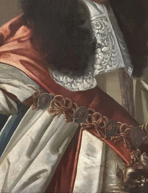 fig 4. A seventeenth-century oil portrait of King Charles II depicting a long periwig, detailed lace cravat, and a draped red mantle.