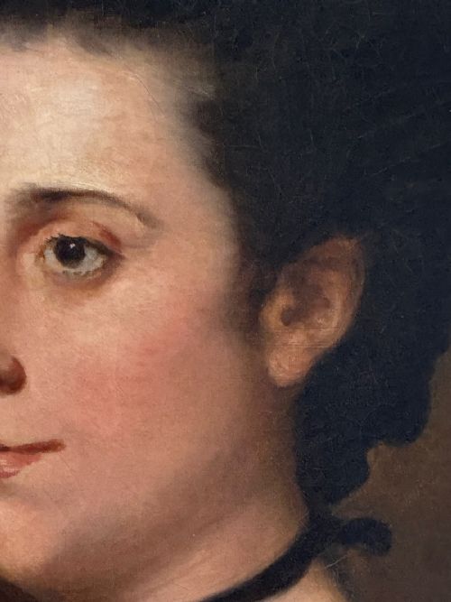 fig 4. An eighteenth-century oil painting depicting a woman styled with high dark hair, a white gown, a blue bodice accent, and a black choker within a painted oval aperture.