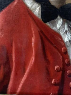 fig 4. An eighteenth-century oil portrait of a gentleman in a scarlet coat with a white cravat, set inside a carved giltwood frame.