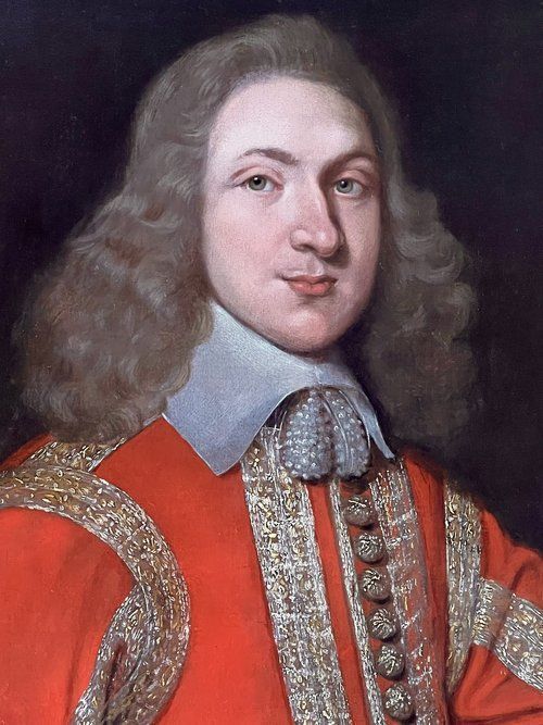 fig 1. An oil portrait on canvas depicting a 17th-century military officer wearing an embroidered red coat with gold trim, a white lace collar, and a draped waist sash.