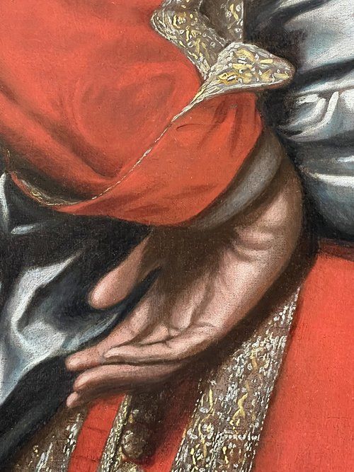 fig 4. An oil portrait on canvas depicting a 17th-century military officer wearing an embroidered red coat with gold trim, a white lace collar, and a draped waist sash.