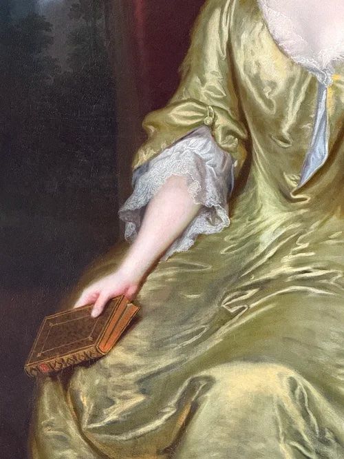 fig 4. An 18th-century oil portrait depicting a seated lady in a chartreuse silk dress with lace trim holding a book.
