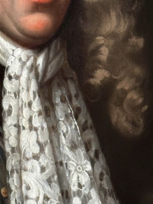fig 4. A late 17th-century oil painting depicting a gentleman wearing plate armour, a powdered wig, and a lace cravat, set within an oval carved gilded frame.
