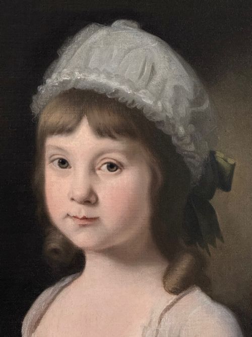 fig 2. An eighteenth-century oil painting on canvas depicting a young girl in a white bonnet and light dress, framed within a feigned oval inside a rectangular gilded wooden frame.