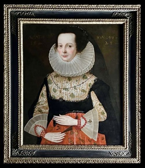 fig 6. A 17th-century framed oil portrait depicting a noblewoman wearing a prominent white linen ruff, an embroidered bodice, lace cuffs, and a black gown.