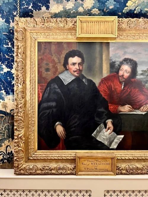 fig 2. An 18th-century oil painting on canvas depicting two seated men in historical attire, presented in a deeply carved gold giltwood frame.