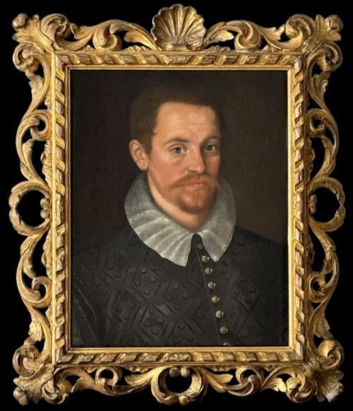 fig 6. An oil painting depicting a seventeenth-century gentleman wearing a dark embroidered doublet and pleated white ruff, encased in a heavily carved giltwood frame.
