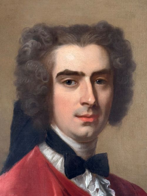 fig 2. An 18th-century oil painting depicting a gentleman in a scarlet jacket with a white cravat, framed in an ornate gilded Rococo-style frame.