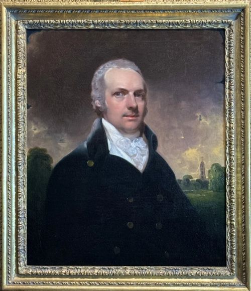 fig 3. An 18th-century oil portrait painting depicting a gentleman in a dark double-breasted coat and white cravat set inside a gilded frame.