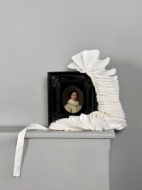 fig 5. An oval 17th-century oil portrait miniature on copper depicting a gentleman with a mustache and lace collar in a black ebonised frame with gilt detail.