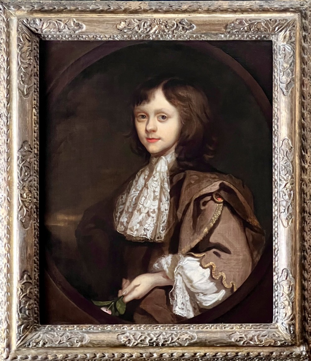 17TH CENTURY OIL ON CANVAS PORTRAIT OF A BOY HOLDING A ROSE - CIRCLE OF SIR PETER LELY (1618-1680)