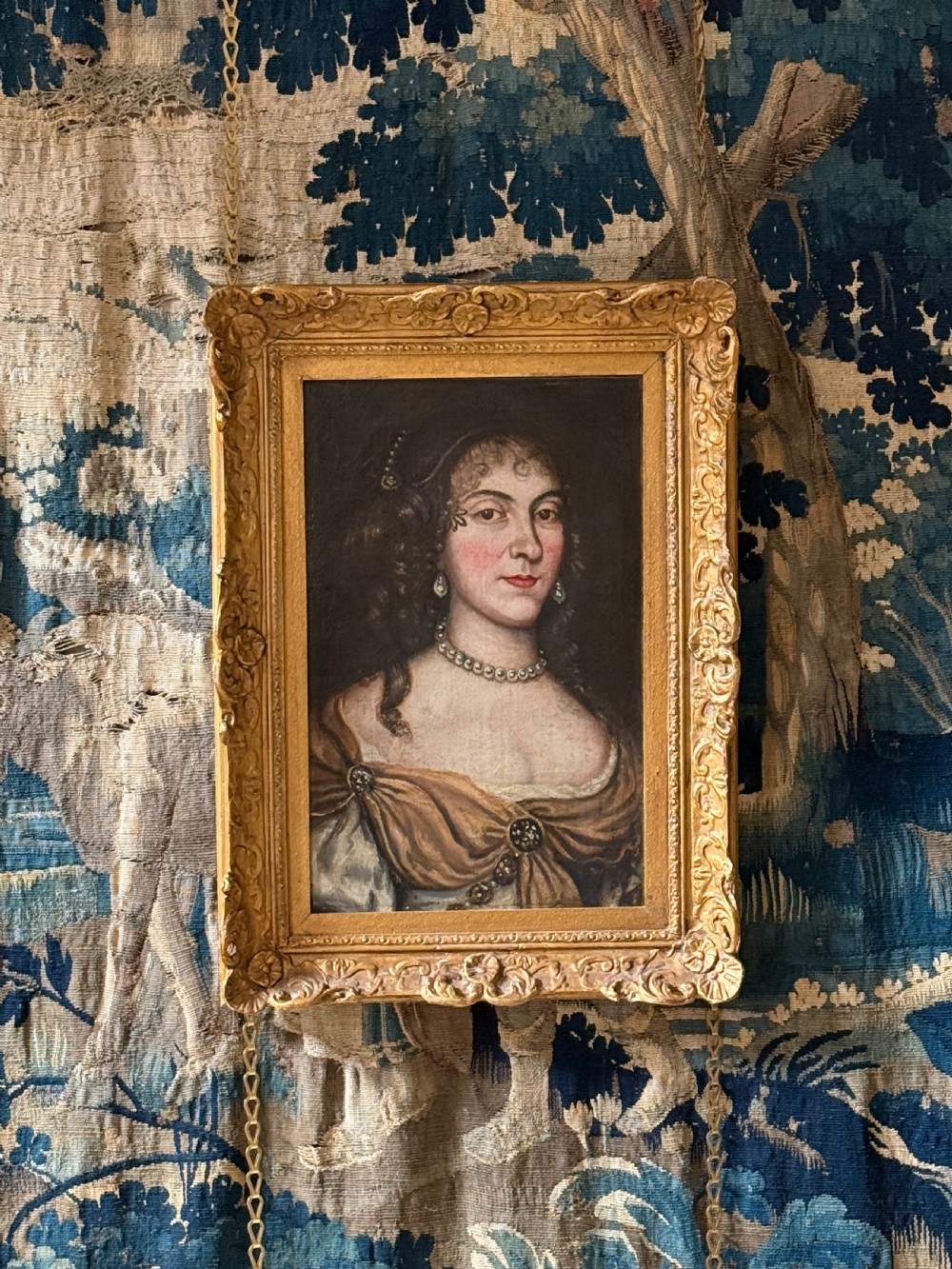 A seventeenth-century oil painting on canvas depicting a noblewoman with pearl jewellery, housed within an ornate carved gilt frame. View III