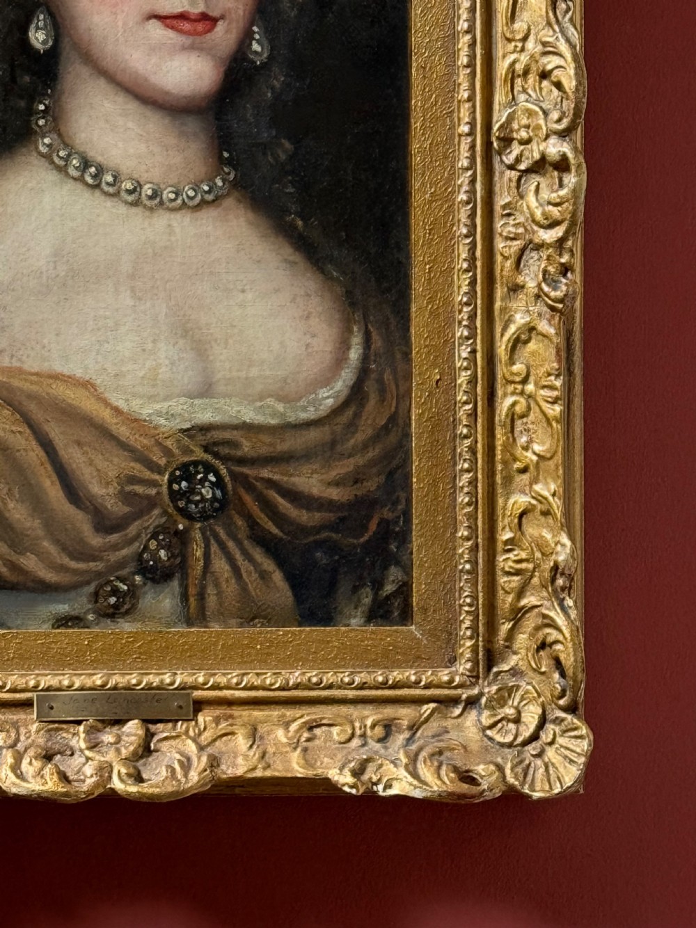 A seventeenth-century oil painting on canvas depicting a noblewoman with pearl jewellery, housed within an ornate carved gilt frame. View IV