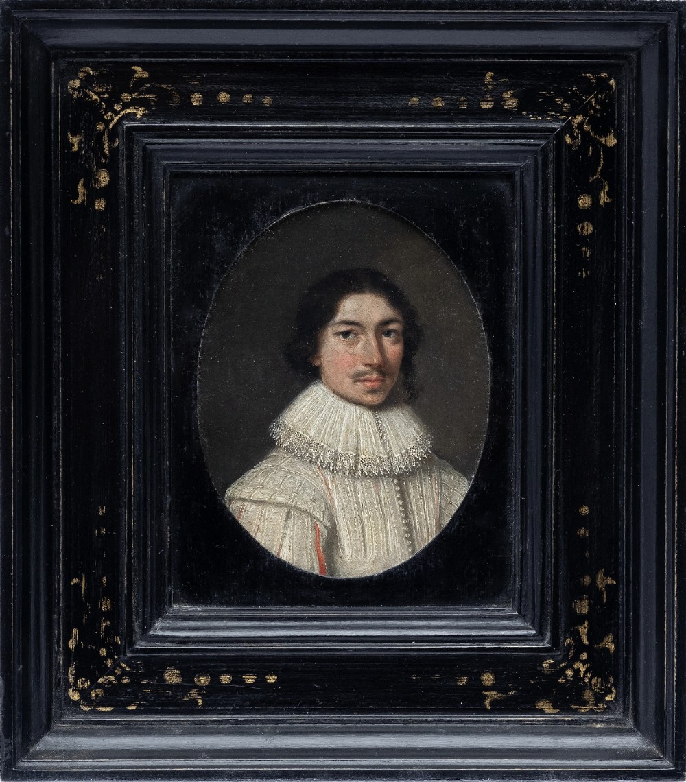 An oval 17th-century oil portrait miniature on copper depicting a gentleman with a mustache and lace collar in a black ebonised frame with gilt detail. View II