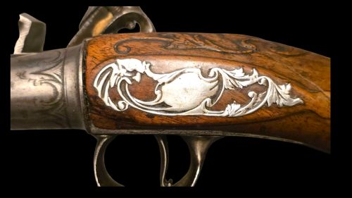 QUEEN ANNE SILVERMOUNTED 18 BORE FLINTLOCK HOLSTER PISTOL BY R WILLOUGHBY BIRMINGHAMEARLY 18THCENTURY ENGLISH FLINTLOCK PISTOL SILVERWIRE INLAID WALNUT GRIP SILVER GROTESQUE BUTT CAP WITH SILVER VACANT CARTOUCHES TO THE TOP AND THE SIDE OF THE STOCK CIRCA 1730 - ADDITIONAL PHOTO 3