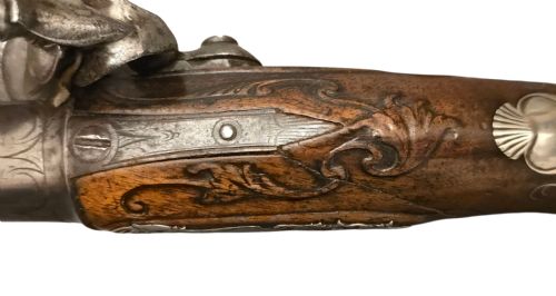QUEEN ANNE SILVERMOUNTED 18 BORE FLINTLOCK HOLSTER PISTOL BY R WILLOUGHBY BIRMINGHAMEARLY 18THCENTURY ENGLISH FLINTLOCK PISTOL SILVERWIRE INLAID WALNUT GRIP SILVER GROTESQUE BUTT CAP WITH SILVER VACANT CARTOUCHES TO THE TOP AND THE SIDE OF THE STOCK CIRCA 1730 - ADDITIONAL PHOTO 12
