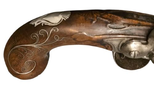 QUEEN ANNE SILVERMOUNTED 18 BORE FLINTLOCK HOLSTER PISTOL BY R WILLOUGHBY BIRMINGHAMEARLY 18THCENTURY ENGLISH FLINTLOCK PISTOL SILVERWIRE INLAID WALNUT GRIP SILVER GROTESQUE BUTT CAP WITH SILVER VACANT CARTOUCHES TO THE TOP AND THE SIDE OF THE STOCK CIRCA 1730 - ADDITIONAL PHOTO 13